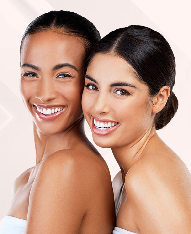 Beautiful mixed raced women posing and smiling | Skin Rejuvenation | Elevate Medical Aesthetics