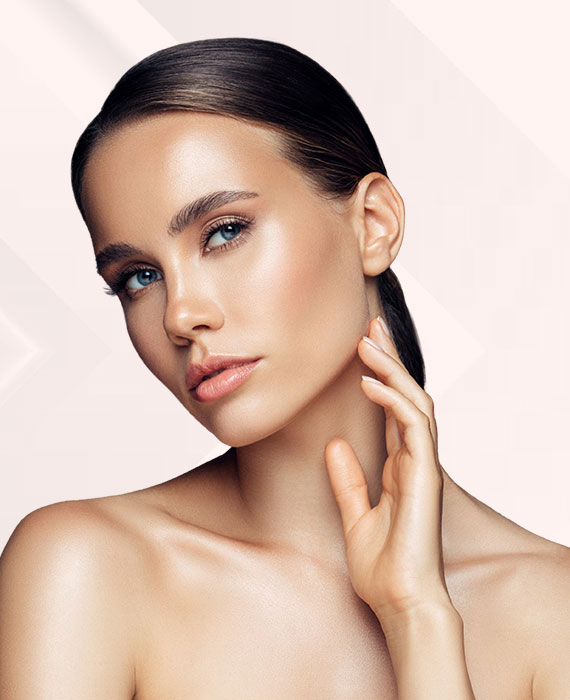 Stunning brunette female model posing and highlighting her fresh and smooth face | Facials | Elevate Medical Aesthetics